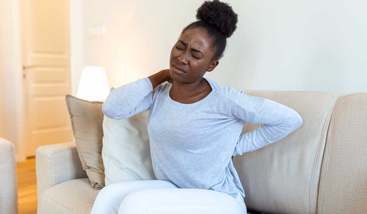 Young black woman suffering from backache