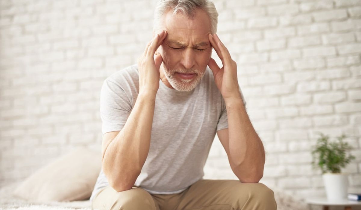 Older man with a headache
