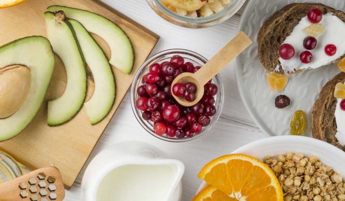 top view breakfast arrangement with yogurt and fruits